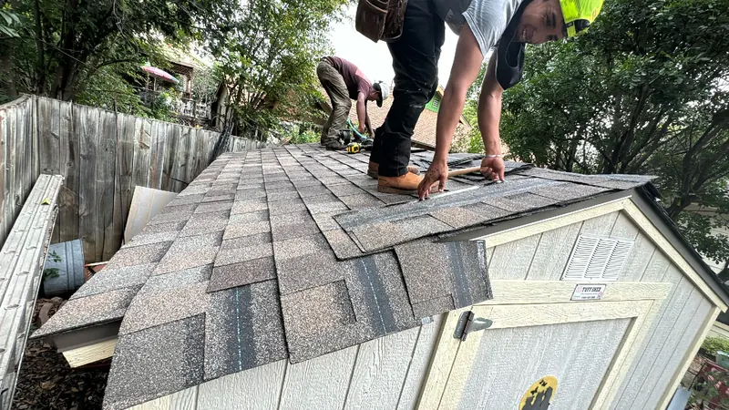 HWT Construction crew installing new architectural shingles in Central Texas