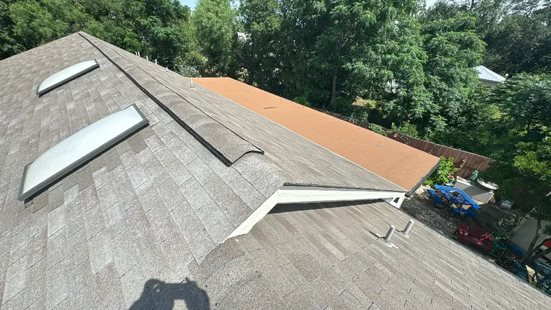 Finished roof replacement viewed across the roof plane