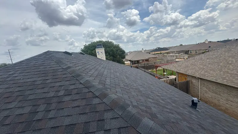 Newly installed shingles on a Central Texas brick home