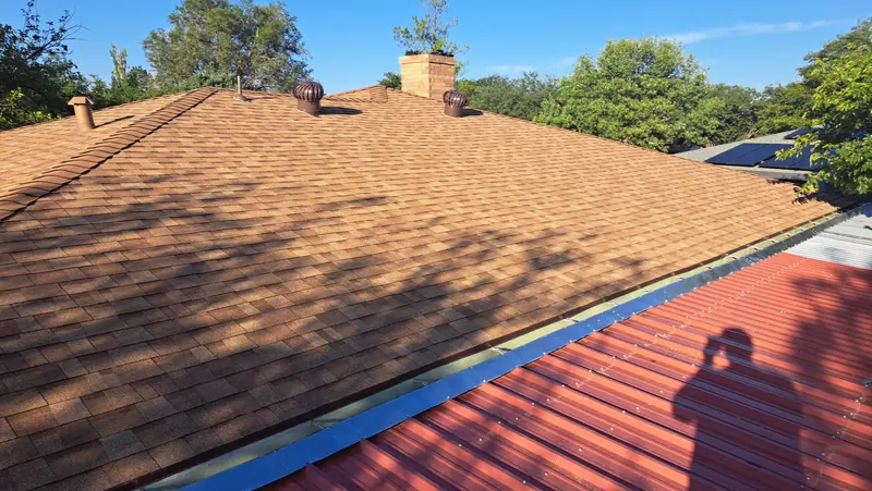 Completed roof replacement and chimney flashing in Central Texas