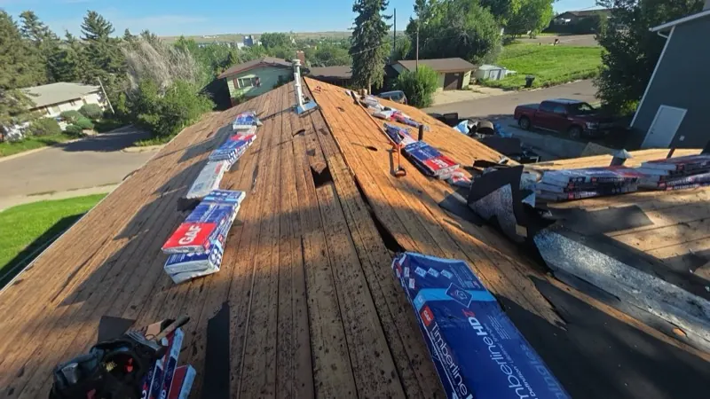 GAF Timberline HDZ shingle bundles staged on a Havre, MT roof