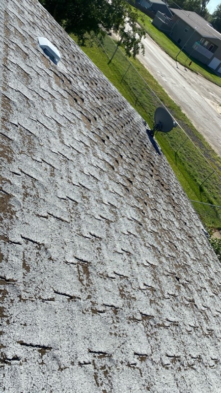 Granule loss caused by hail impact