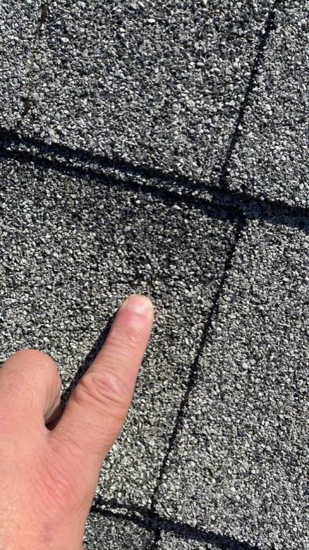 Hail impact close-up on a shingle