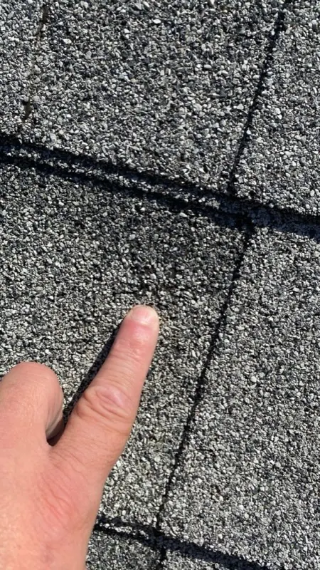 Hail impact close-up on a shingle