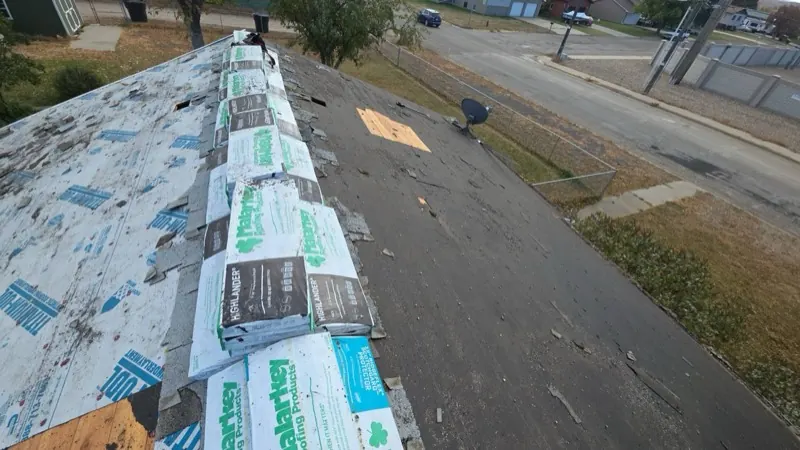 Shingle removal in progress on a Havre, MT roof